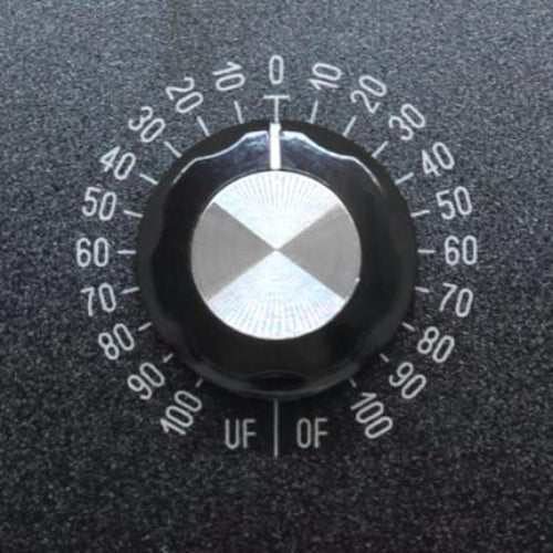 Close-up of the Function Dial on the Berkana Labs 9 Dial Radionic Instrument, showing the Under Function (UF) and Over Function (OF) intensity scales for analysis and treatment.