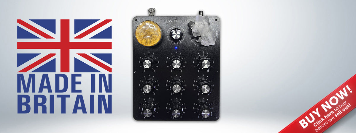 The Berkana Labs 9 Dial Radionic Instrument in use with a crystal witness and orgonite, featuring the Made in Britain seal. This professional radionics machine is designed for precision rate tuning and broadcast.